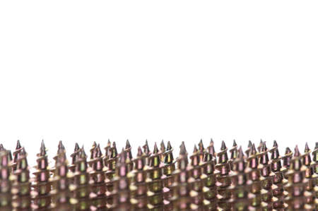 Close-up of golden screws as technology backgroundの写真素材