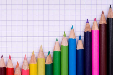 Close-up image of multicolor pencils on paper backgroundの写真素材