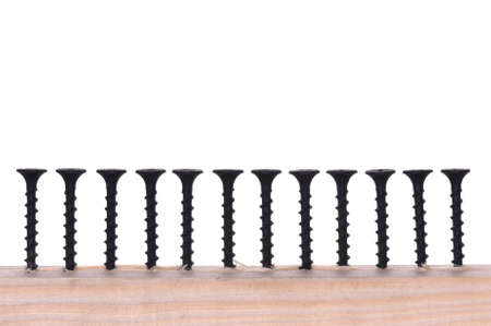 Close-up of black screws as technology white backgroundの写真素材