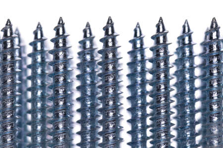 Close-up of silver screws as technology backgroundの写真素材