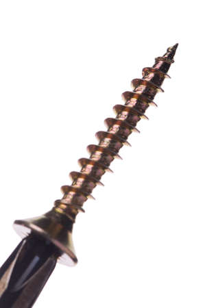 Close-up of screwdriver and screw on white backgroundの写真素材