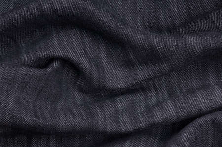 Denim fabric texture ideal for background, close-up of jeansの写真素材