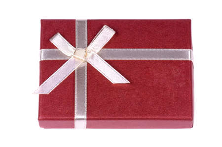 One red gift box with white ribbon and bow isolatedの写真素材