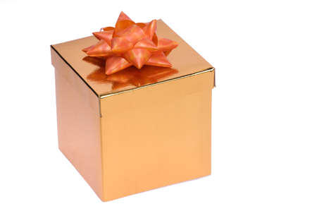 Golden gift box with red ribbon and bow isolatedの写真素材