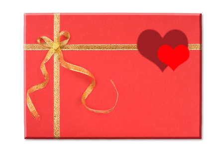 Red blank note and golden ribbon isolated on white background for Valentine's Dayの写真素材