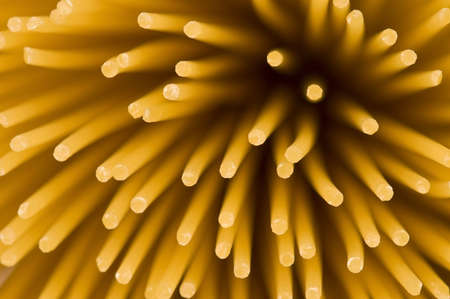 Uncooked spaghettis background, Italian long pasta, foodの写真素材