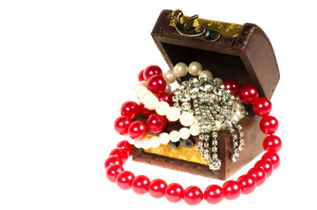 Wooden treasure chest with valuables, isolated over white backgroundの写真素材