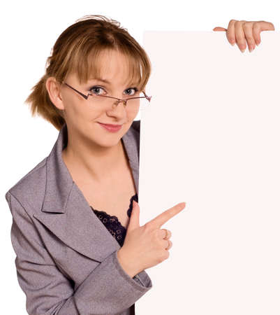 Portrait of a pretty young woman in glasses, holding a blank sign for your message. Education or business concept. Beautiful caucasian model isolated on white background.の写真素材