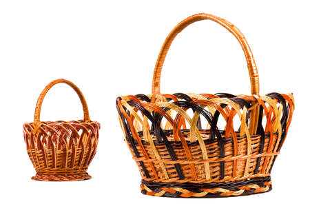 Traditional wicker baskets isolated on white background. Focus on the big basket.の写真素材
