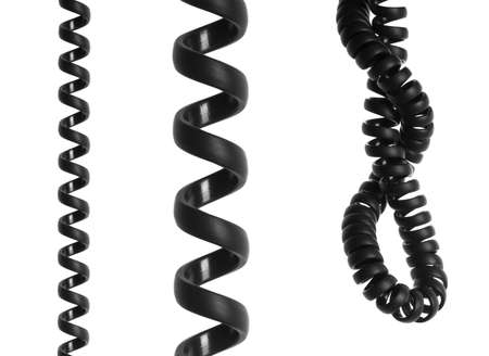 Black spiral telephone cable isolated on white backgroundの写真素材