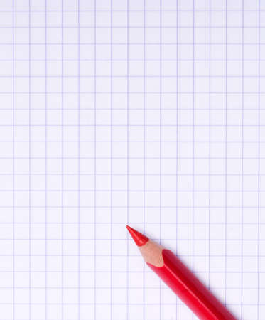 Close-up image of red pencil on paper backgroundの写真素材