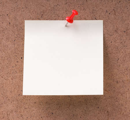 Note paper with push pins on noticeboardの写真素材