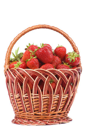 Ripe strawberry in wicker basketbasket isolated on a white backgroundの写真素材