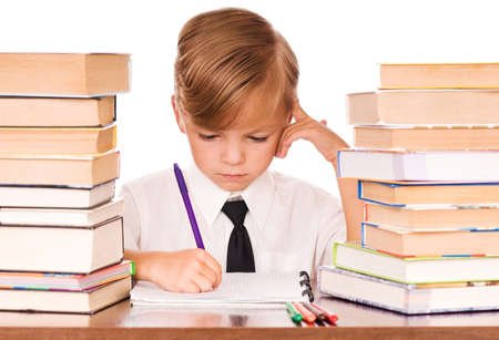 Six years boy writing in the notebook