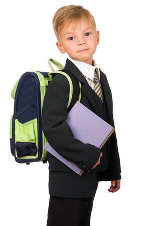 Boy in suit with book isolated on white background. Beautiful caucasian model.の写真素材