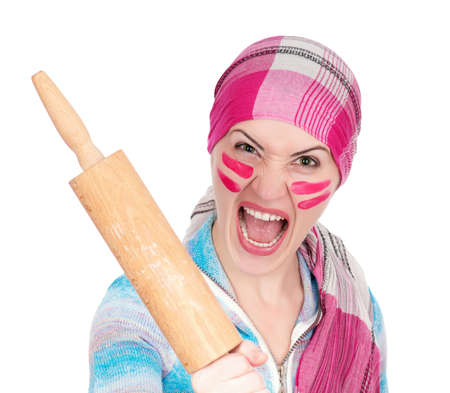 Mad housewife with rolling pin on white background の写真素材