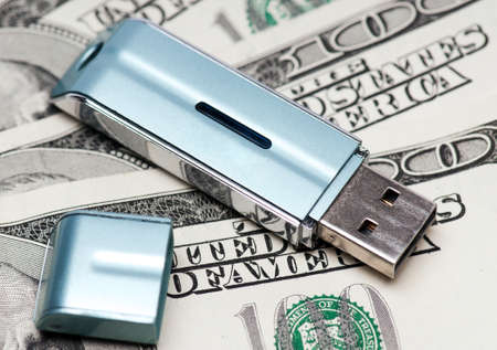 Portable usb flash drive on dollars background