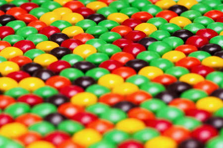 Background of colorful candies coated chocolate sweetsの写真素材