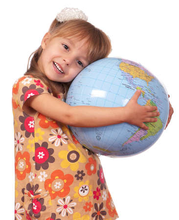 Smiling little girl holding globe. Isolated on white background.の写真素材