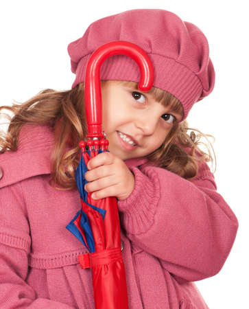 Portrait of a pretty little girl with umbrella. Isolated on white background.の写真素材
