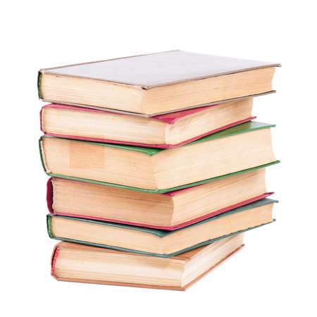 Pile of old dirty books on a white backgroundの写真素材