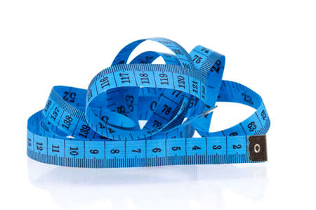 Measuring tape of the tailor over white background