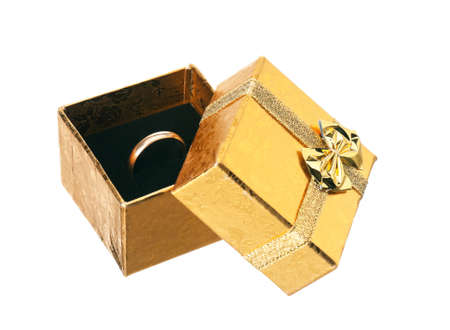 Golden gift box with ribbon and bow on white backgroundの写真素材