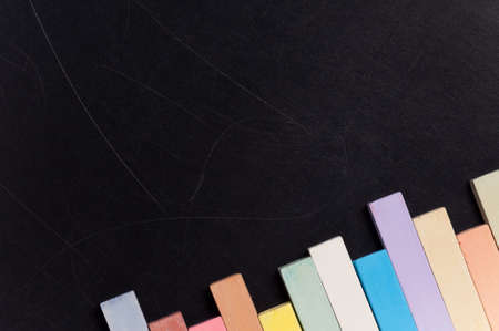 Empty blank black chalkboard with colorful chalkの写真素材