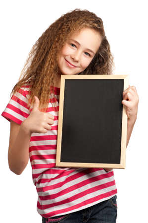 Portrait of girl with blackboard isolated on white backgroundの写真素材