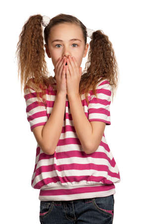 Speak no evil - portrait of girl isolated on white backgroundの写真素材