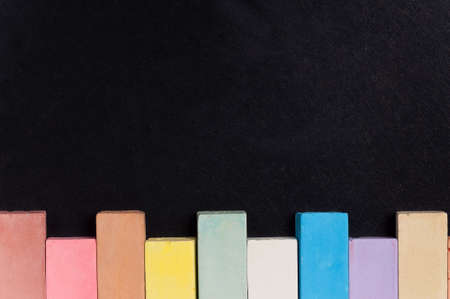Empty blank black chalkboard with colorful chalkの写真素材