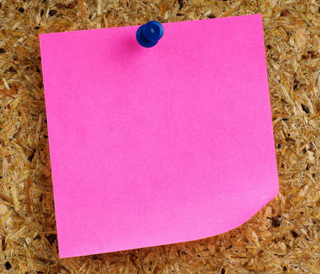 Note paper with push pins on noticeboardの写真素材