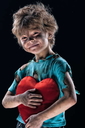 Boy burnt of love with heart over white backgroundの写真素材