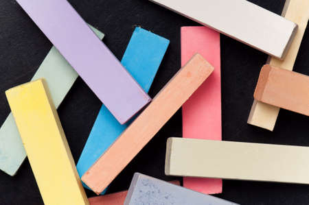 Empty blank black chalkboard with colorful chalkの写真素材