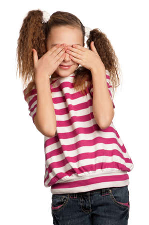 See no evil - portrait of girl isolated on white backgroundの写真素材