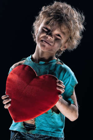 Boy burnt of love with heart over white backgroundの写真素材