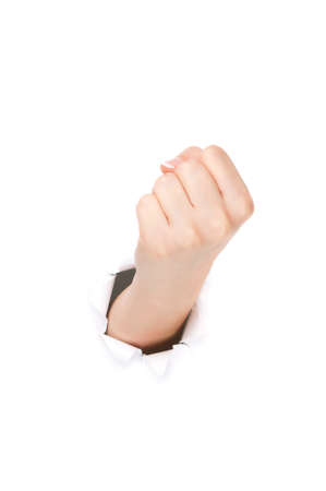 Woman hand making sign through a hole in paper isolated on white backgroundの写真素材
