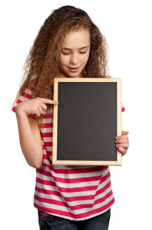 Portrait of girl with blackboard isolated on white backgroundの写真素材