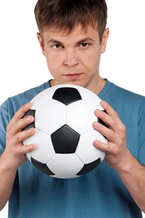 Portrait of a man standing with classic soccer ball on isolated white backgroundの写真素材