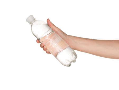Woman hand with bottle of water isolated on white backgroundの写真素材
