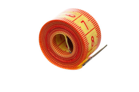 Measuring tape of the tailor over white background
