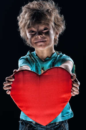 Boy burnt of love with heart over white backgroundの写真素材