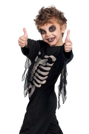 Portrait of little boy wearing halloween costume on white backgroundの写真素材