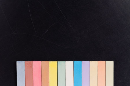 Empty blank black chalkboard with colorful chalk