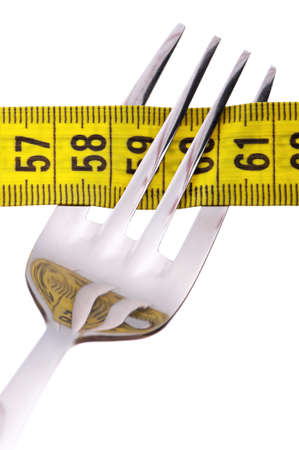 Fork with measure tape isolated on white backgroundの写真素材