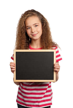 Portrait of girl with blackboard isolated on white backgroundの写真素材