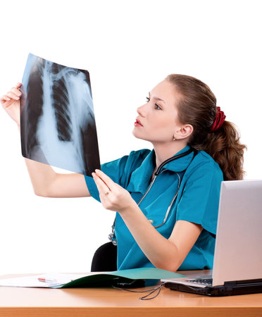 Medical doctor analysing x-ray photography on white background