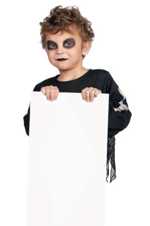 Portrait of little boy wearing halloween costume with empty white board on white backgroundの写真素材