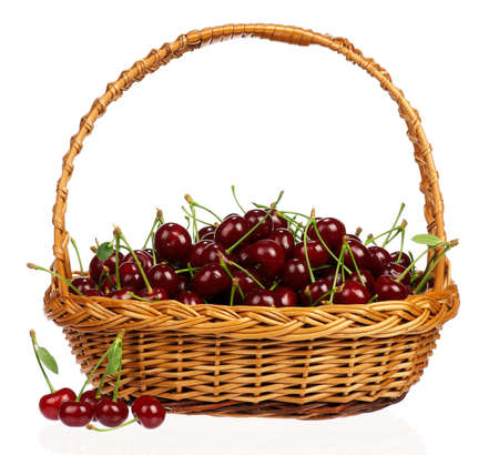 Sweet cherries in a basket isolated on a white backgroundの写真素材