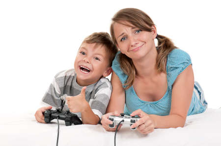 Happy family - mother and child playing a video gameの写真素材